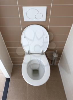 Modern white toilet bowl in the bathroom