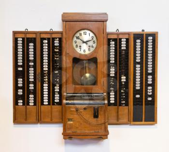 Vintage time clock on a white background