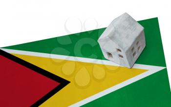Small house on a flag - Living or migrating to Guyana