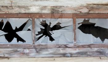Close up of a broken window, abandoned building in Austria