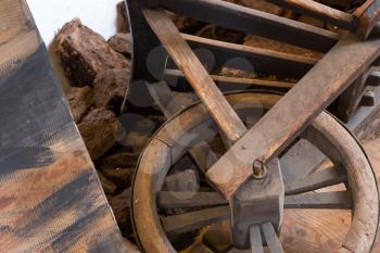 Old wheel on a wheelbarrow, selective focus