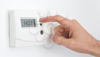 Vintage digital thermostat - Hot - Man adjusting the temperature