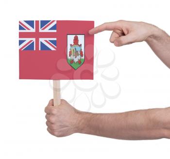 Hand holding small card, isolated on white - Flag of Bermuda