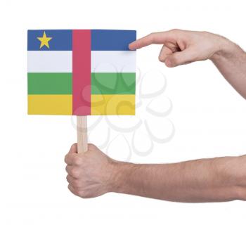 Hand holding small card, isolated on white - Flag of Central African Republic