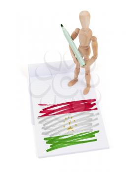 Wooden mannequin made a drawing of a flag - Tajikistan