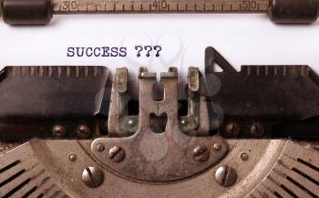 Vintage typewriter close-up - Success with questionmarks, concept of success