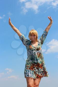 blue-eyed sympathetic girl on the background of blue sky