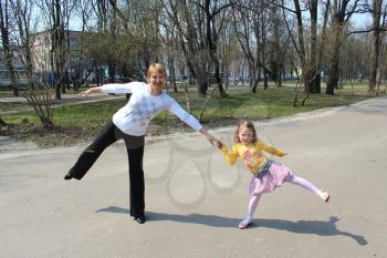 image of mother and the daughter dancing in the city