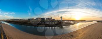 Panorama of Wooden Pier and Lighthouse in Trouville and Deauville in a beautiful summer evening, France