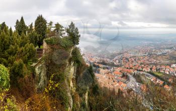 Panoramic aerial view of San Marino in foggy winter day