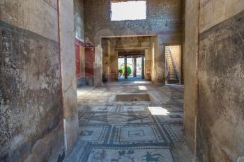 Living room in Pompeii city destroyed in 79BC by the eruption of volcano Vesuvius, Italy in a beautiful summer day