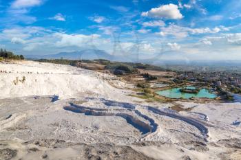 Travertine pools and terraces in Pamukkale, Turkey in a beautiful summer day