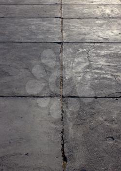 Grunge concrete cement way with cracks at sun light