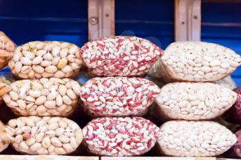 Photo of counter in market place with bean and nuts