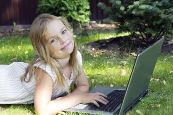 Image of cute girl with laptop in summer