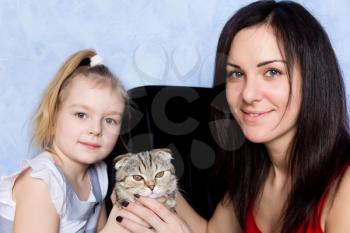 Image of mother, daughter and grey kitty