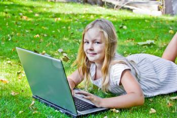 Photo of cute girl with laptop in summer
