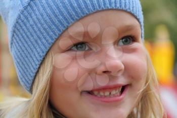 Portrait of beautiful girl with blond hair and blue eyes