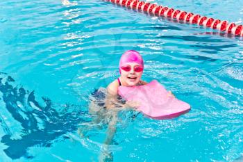 Photo of cute girl in swimming pool