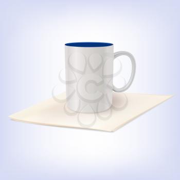 White ceramic cup standing on a napkin. Template for your design.