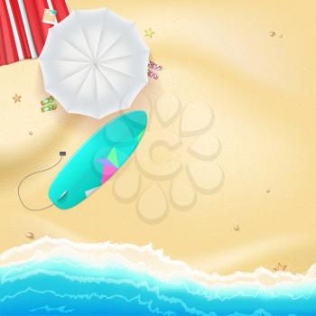 Summer travel background. Sunny sandy beach with umbrella, mat, slippers and a surfboard. Tropical seashore with a view of the surf, top view.