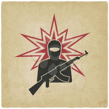 terrorist with gun old background.
