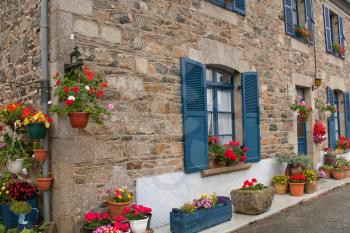traditional decorative flowers on around house in Normandy, France