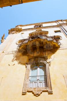 old window in baroque style house, Noto, Italy
