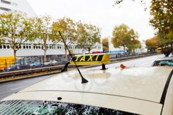 taxi car on urban road in Berlin in autumn day