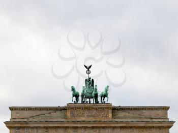 bronze quadriga on brandenburg gate in Belin in cloudy autumn day