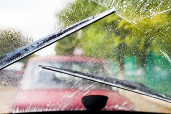 auto wipers wash windshield when driving in rain