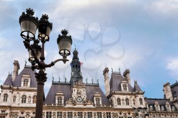 urban lamps and Hotel de Ville (City Hall) in Paris , France