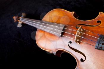 violin deck on black velvet background close up