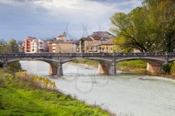 view of Parma stream and Ponte Verdi in autumn day, Italy