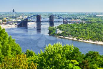 panorama of Kiev with Podilsko-Voskresenskyi Bridge on Dnieper River in Kiev, Ukraine