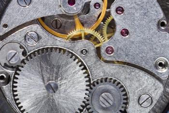 steel gears of old mechanical watch close up