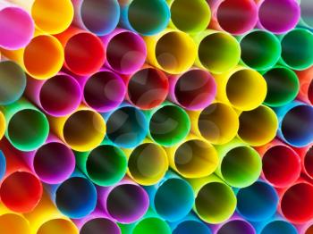 abstract background from end of multicoloured plastic drinking straws close up