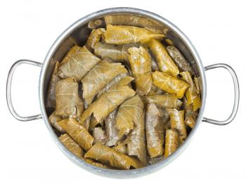 cooking of Caucasus meal - dolma from pickled vine leaves and mince in stewpan isolated on white background