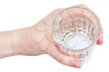above view of hand holding clear water in glass isolated on white background