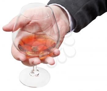 cognac glass in businessman hand isolated on white background