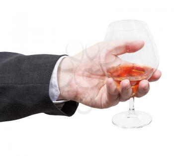 brandy glass in businessman hand isolated on white background