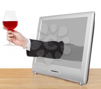red wine glass in male hand leans out TV screen isolated on white background