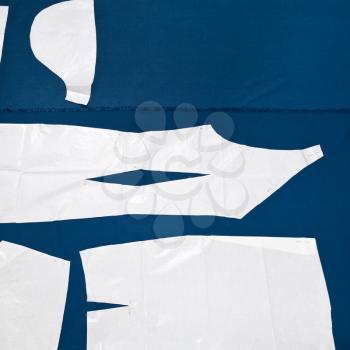 paper samples of clothes on blue fabric for dress cutting
