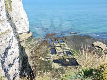 old oyster farm and cliff on english channel beach of Etretat cote d'albatre, France