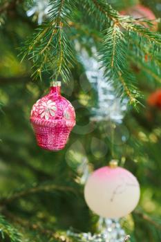 pink ball and house christmas tree vintage decoration close up