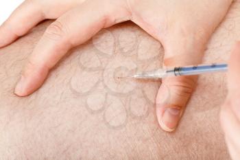 patient makes diabetic insulin injections in the thigh