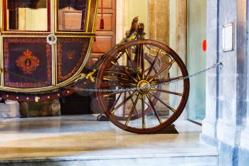 CATANIA, ITALY - APRIL 5, 2015: wooden coach in Town Hall of Catania. This carriage is used for the urban Festivals, such as of the feast of St. Agatha in Catania, Sicily