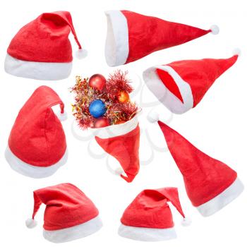christmas symbol - set of typical red santa claus hat isolated on white background