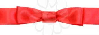 real red bow knot on wide silk ribbon isolated on white background
