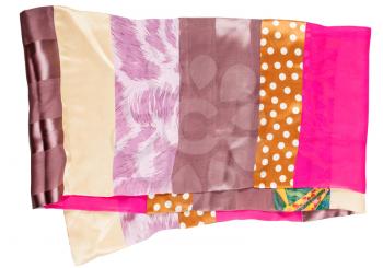 handmade sewing patchwork silk scarf from narrow cloth pieces isolated on white background